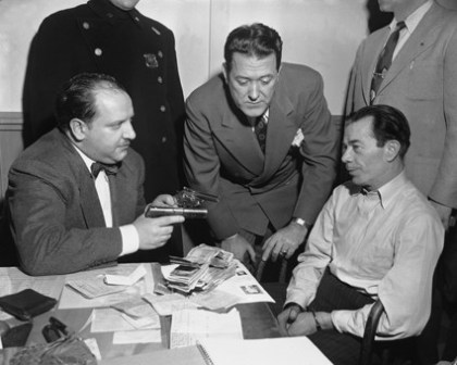 Willie Sutton, right, is questioned after his arrest in Brooklyn in 1952.